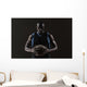 Portrait of basketball player holding a ball Wall Mural