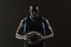 Portrait of basketball player holding a ball Wall Mural