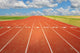 Running Track With Clouds Wall Mural