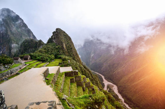 Machu Picchu - the UNESCO heritage in summer time with sunset Wall Mural