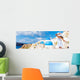 Europe tourist travel woman panorama banner from Oia, Santorini, Greece. Happy young woman looking at famous blue dome church landmark destination. Beautiful girl visiting the Greek islands. Wall Mural