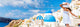 Europe tourist travel woman panorama banner from Oia, Santorini, Greece. Happy young woman looking at famous blue dome church landmark destination. Beautiful girl visiting the Greek islands. Wall Mural