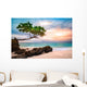 Exotic seascape with sea grape trees leaning above a rocky Caribbean beach at sunset, in Cayo Levantado, Dominican Republic Wall Mural