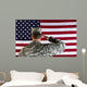 Veteran male solider saluting the flag of USA Wall Mural