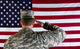 Veteran male solider saluting the flag of USA Wall Mural