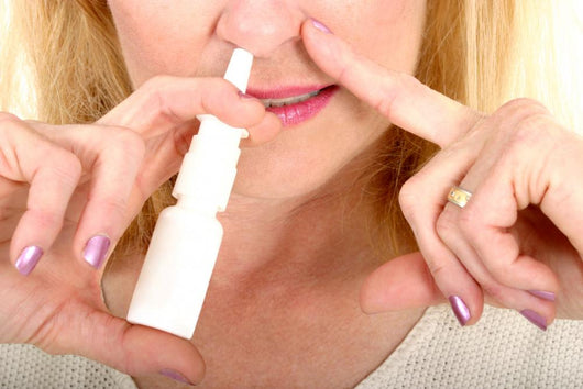 Spraying Nasal Spray in Nose Wall Mural