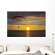 The parachute above the sea on a sunset Wall Mural