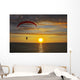 The parachute above the sea on a sunset Wall Mural