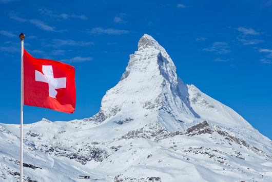 Famous Matterhorn with flag of switzerland Wall Mural