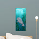 Manatee swimming under the water Wall Mural