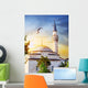 Dome and spire of mosque at sunset Wall Mural