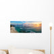 Panoramic view of tropical beach with surfers at sunset. Wall Mural
