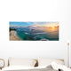 Panoramic view of tropical beach with surfers at sunset. Wall Mural