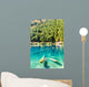 Fantastic azure water of lake with submerged tree trunks Wall Mural