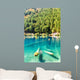 Fantastic azure water of lake with submerged tree trunks Wall Mural