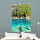 Fantastic azure water of lake with submerged tree trunks Wall Mural