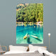 Fantastic azure water of lake with submerged tree trunks Wall Mural