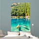 Fantastic azure water of lake with submerged tree trunks Wall Mural