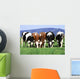 a group of cows grazing Wall Mural