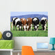 a group of cows grazing Wall Mural