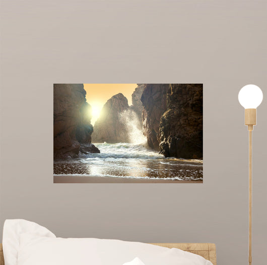 Fantastic big rocks and ocean waves at sundown time Wall Mural