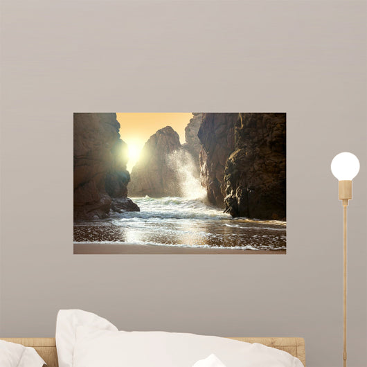 Fantastic big rocks and ocean waves at sundown time Wall Mural