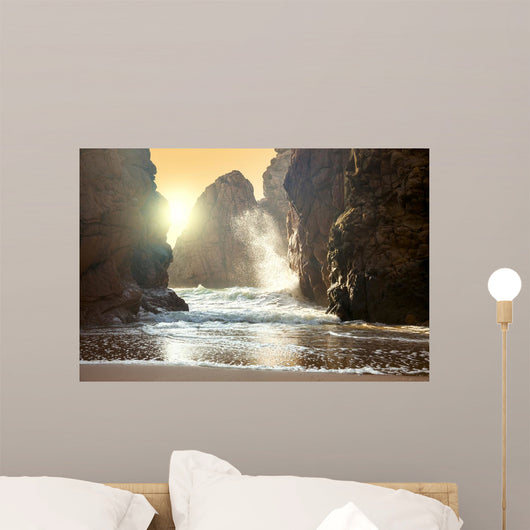 Fantastic big rocks and ocean waves at sundown time Wall Mural