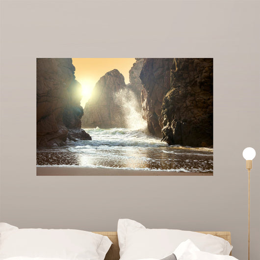 Fantastic big rocks and ocean waves at sundown time Wall Mural