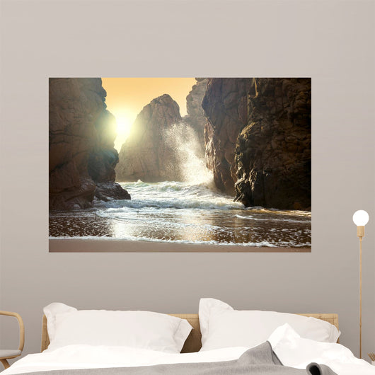 Fantastic big rocks and ocean waves at sundown time Wall Mural