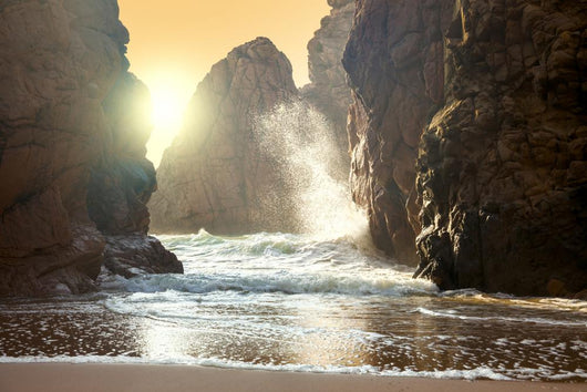 Fantastic big rocks and ocean waves at sundown time Wall Mural