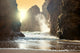 Fantastic big rocks and ocean waves at sundown time Wall Mural