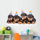 Group of puppies Rottweiler with birthday hats. isolated on white Wall Decal