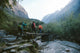 Group of hikers crossing the bridge Wall Mural
