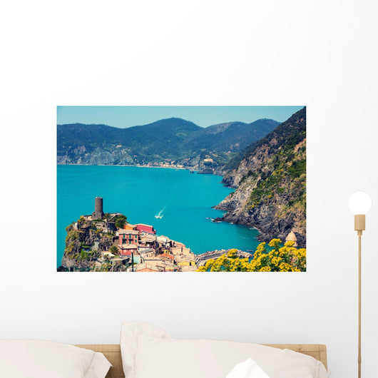 Rocky sea coast. Ligurian sea, view at Vernazza Village, Cinqe Terre, Italy Wall Mural