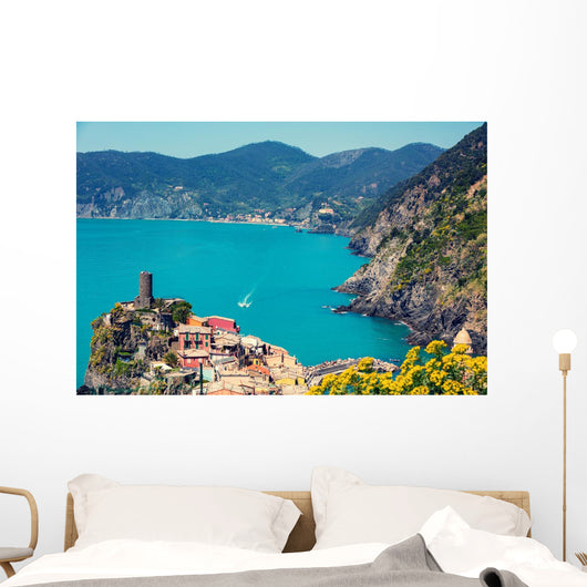 Rocky sea coast. Ligurian sea, view at Vernazza Village, Cinqe Terre, Italy Wall Mural
