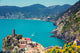 Rocky sea coast. Ligurian sea, view at Vernazza Village, Cinqe Terre, Italy Wall Mural