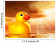 Rubber duckling in evening sunshine on the sea Wall Mural
