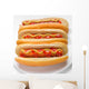 three classic hotdogs with mustard and ketchup on a plate Wall Mural