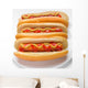 three classic hotdogs with mustard and ketchup on a plate Wall Mural