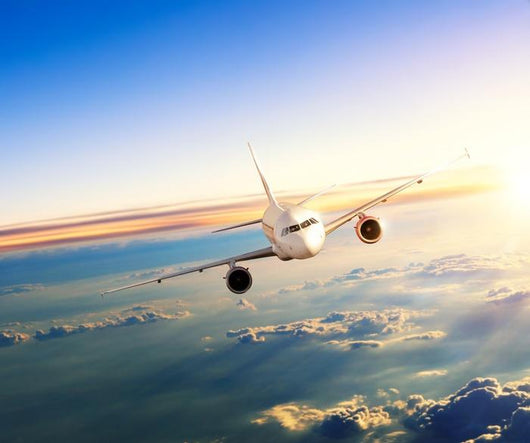 Airplane Flying Closer above Clouds Wall Decal