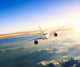 Airplane Flying Closer above Clouds Wall Decal