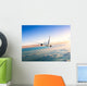 Airplane Flying Away above Clouds Wall Decal
