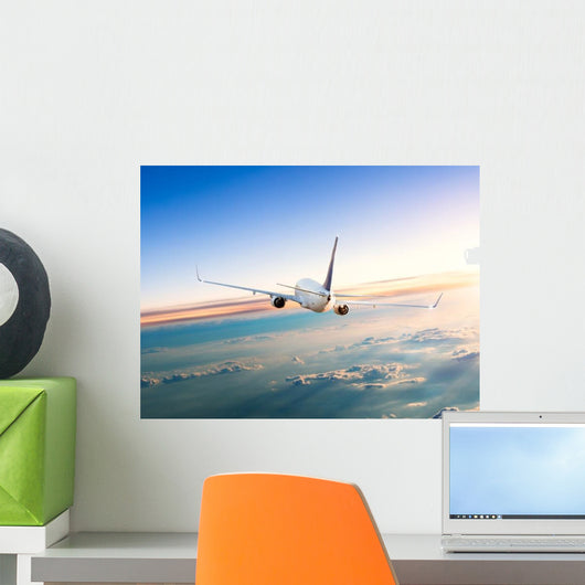 Airplane Flying Away above Clouds Wall Decal