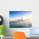 Airplane Flying Away above Clouds Wall Decal
