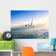 Airplane Flying Away above Clouds Wall Decal