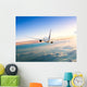 Airplane Flying Away above Clouds Wall Decal