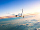 Airplane Flying Away above Clouds Wall Decal