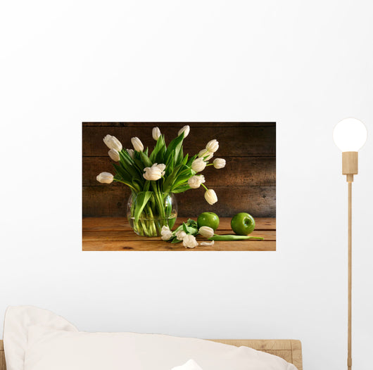 White tulips in glass vase on rustic wood Wall Mural