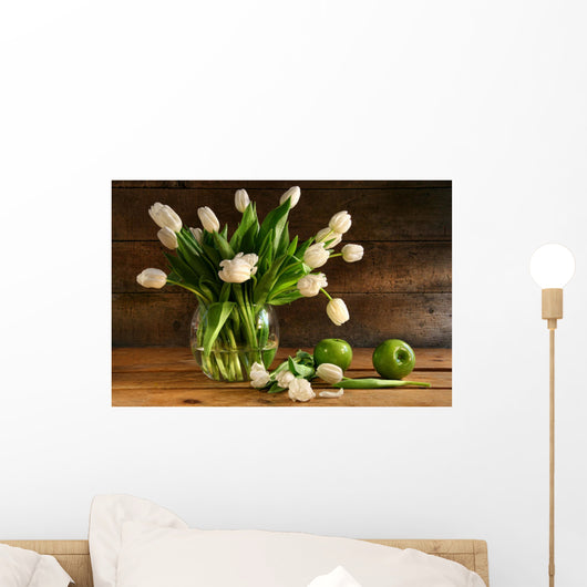 White tulips in glass vase on rustic wood Wall Mural