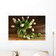 White tulips in glass vase on rustic wood Wall Mural